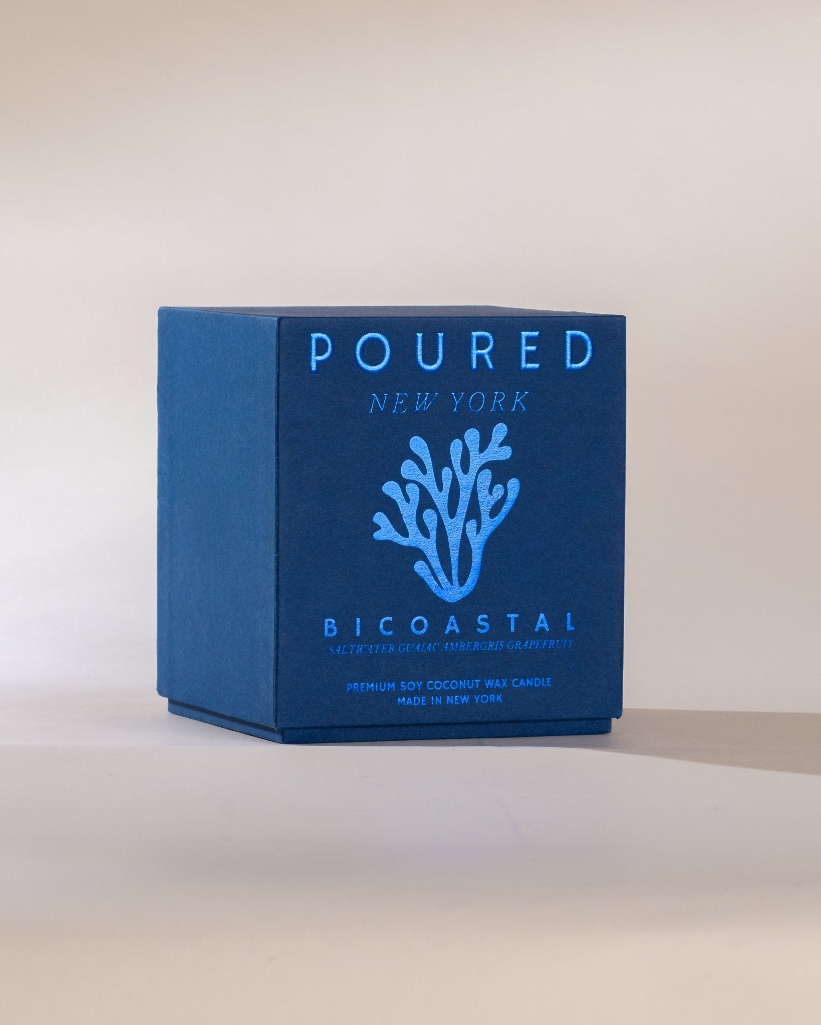 Blue box with 'POURED NEW YORK' branding on a light background