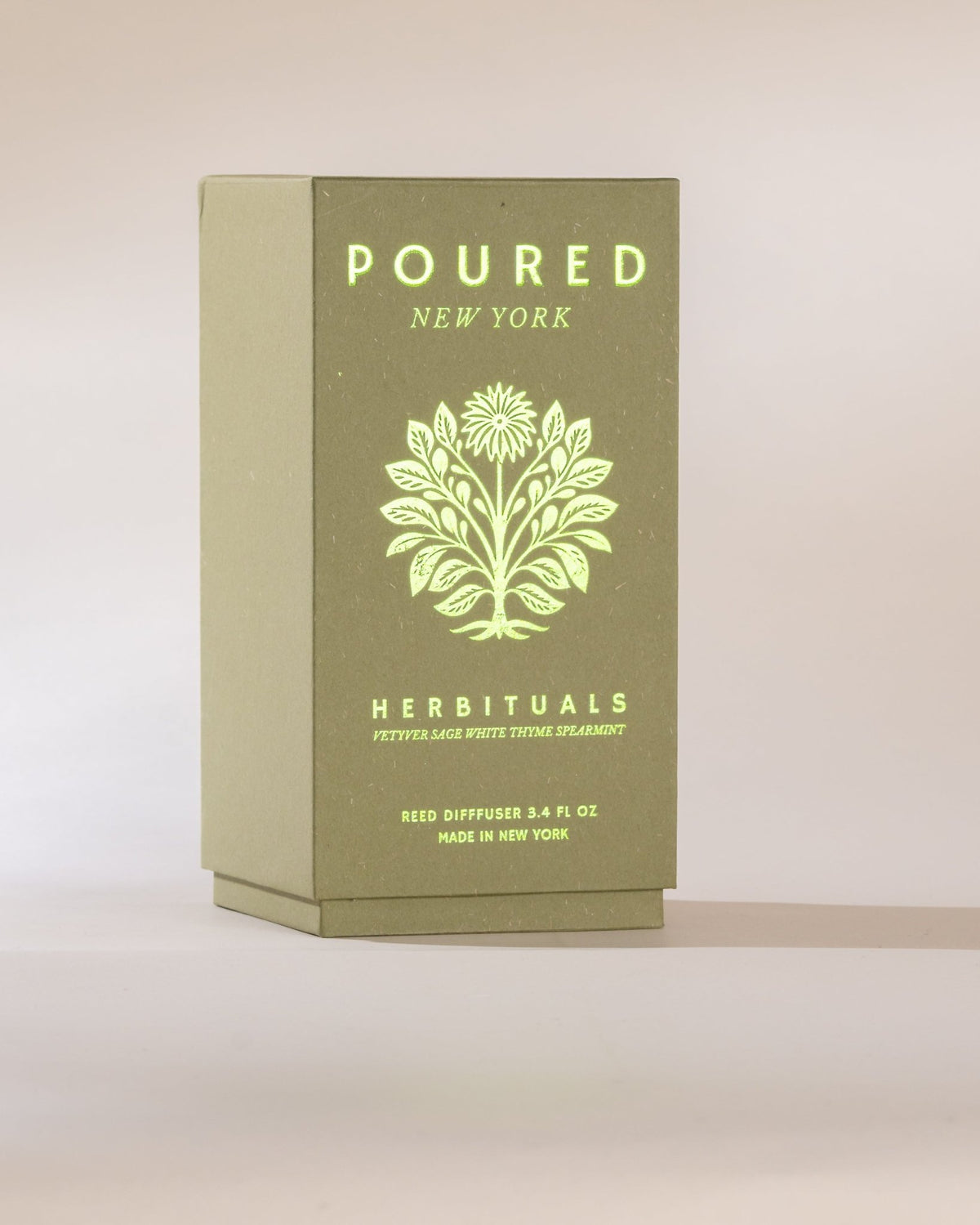 Green box with 'Poured New York' branding and a tree logo on a beige background