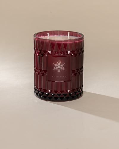 Poured New York 'Be Myrrhy' 22 oz red glass vintage etched coconut soy wax candle on a neutral background
