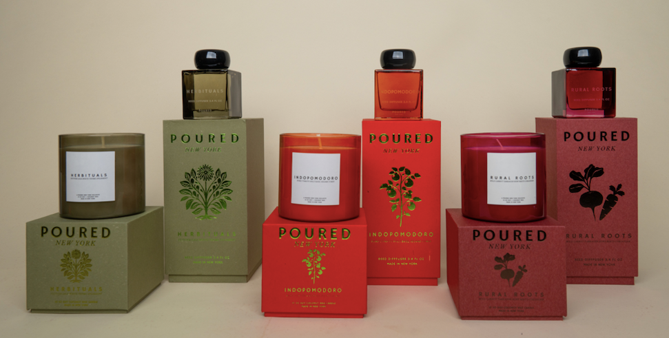 Collection of 'POURED' candles and boxes on a beige background