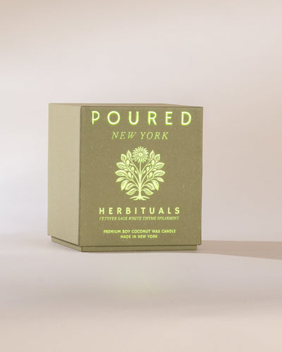 Box of 'Poured New York' Herbituals candle on a light background