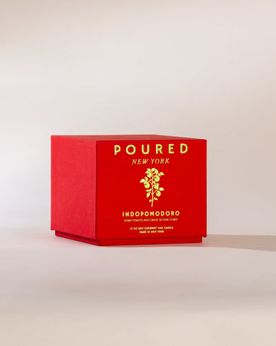 Poured New York 'Indopomodoro' tomato red candle box with tomato vine decal on neutral background