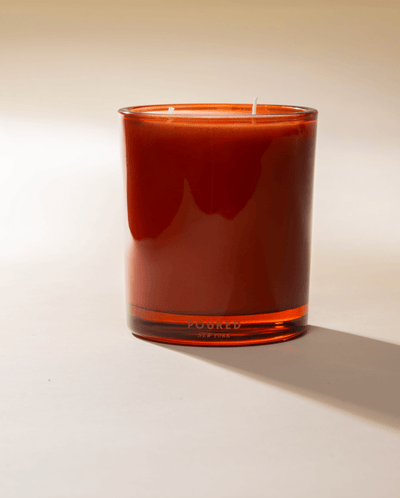 Poured New York 'Indopomodoro' tomato red glass two wick candle on neutral background