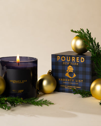 Poured New York 'Naughty List' candle styled in a lifestyle scene