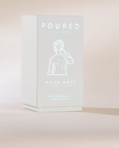 Product packaging with 'POURED' and 'NOUD BOIS' text on a light background
