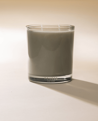 Poured New York 'Noud Bois' Two Wick candle on neutral background