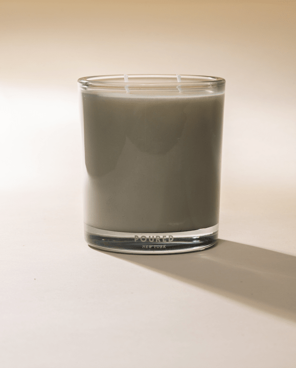 Poured New York 'Noud Bois' Two Wick candle on neutral background