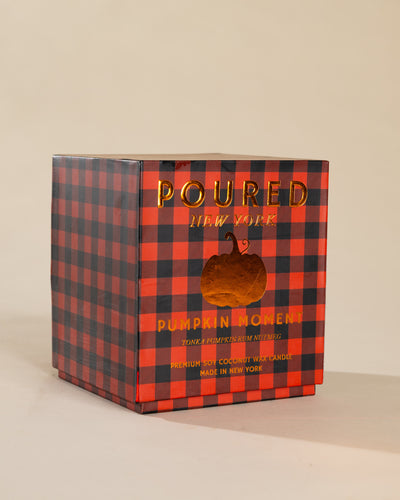 Poured New York 'Pumpkin Moment' candle box packaging on a neutral background