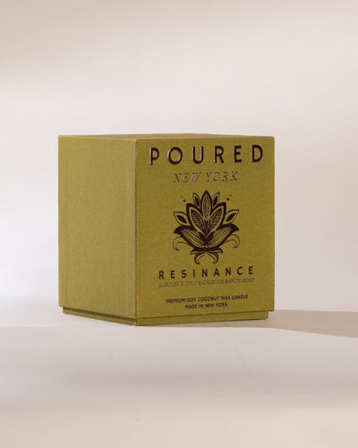 Box of 'POURED NEW YORK' Resinance candle on a beige background