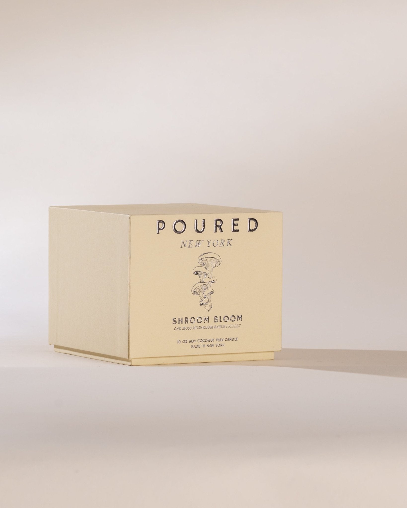 Box of 'Poured New York' mushroom product on a beige background