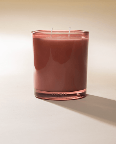 Poured New York 'Voile en Rose' pink two wick glass candle on neutral background