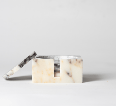 Purple and Cream Marble Square Coaster Set that comes with four matching noir marble coasters with one of the coasters leaning on the set with a neutral background.