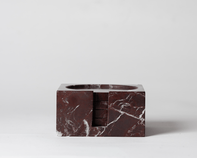 Dark Red Marble Square Coaster Set that comes with four matching dark red marble coasters on a neutral background.