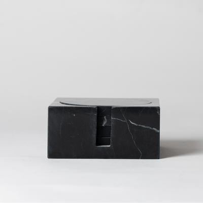 Noir Marble Square Coaster Set that comes with four matching noir marble coasters on a neutral background.